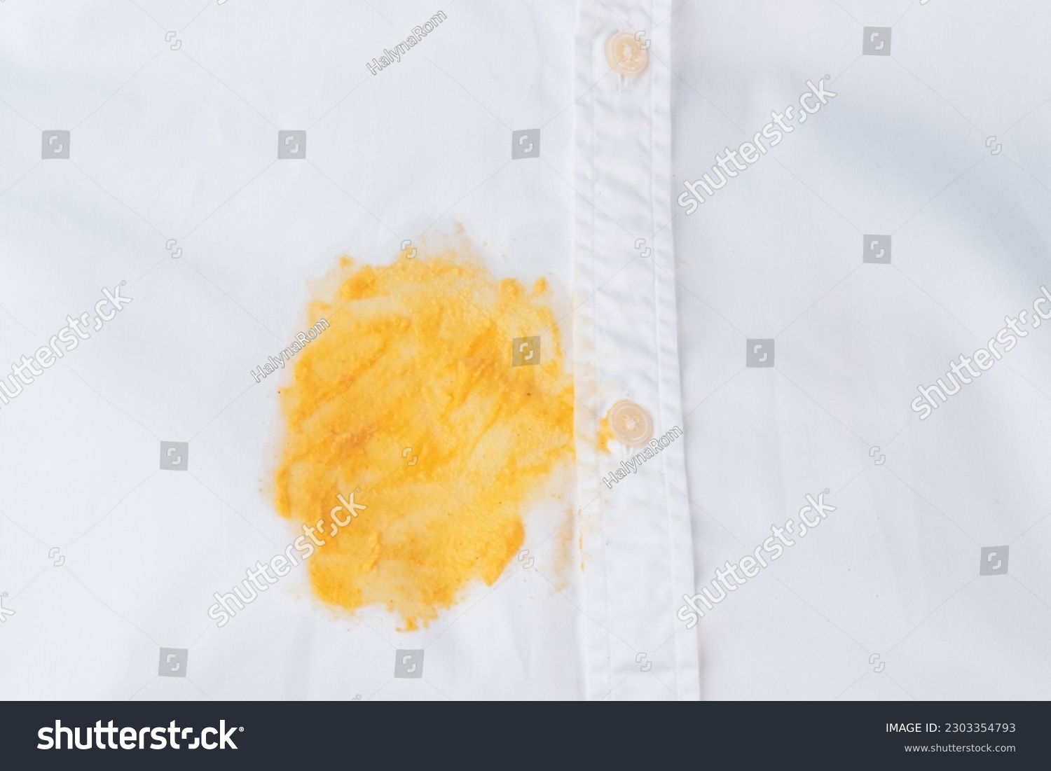 Dirty yellow stain on a white shirt. Spoiled linen. isolated. top view. High quality photo #2303354793