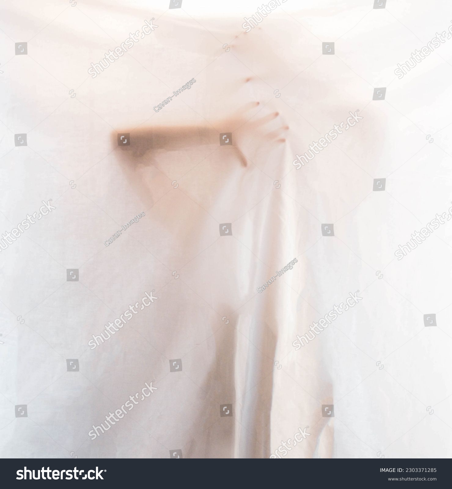 mysterious female hands hidden behind a white sheet #2303371285