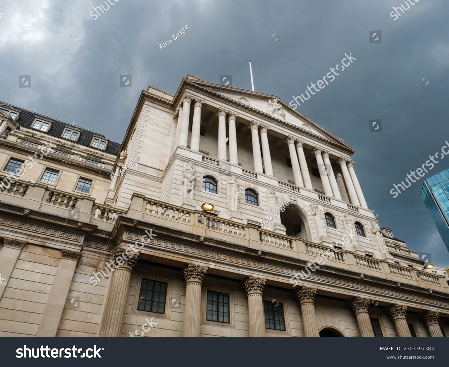 The Bank of England under dark stormy clouds, London, UK #2303397383