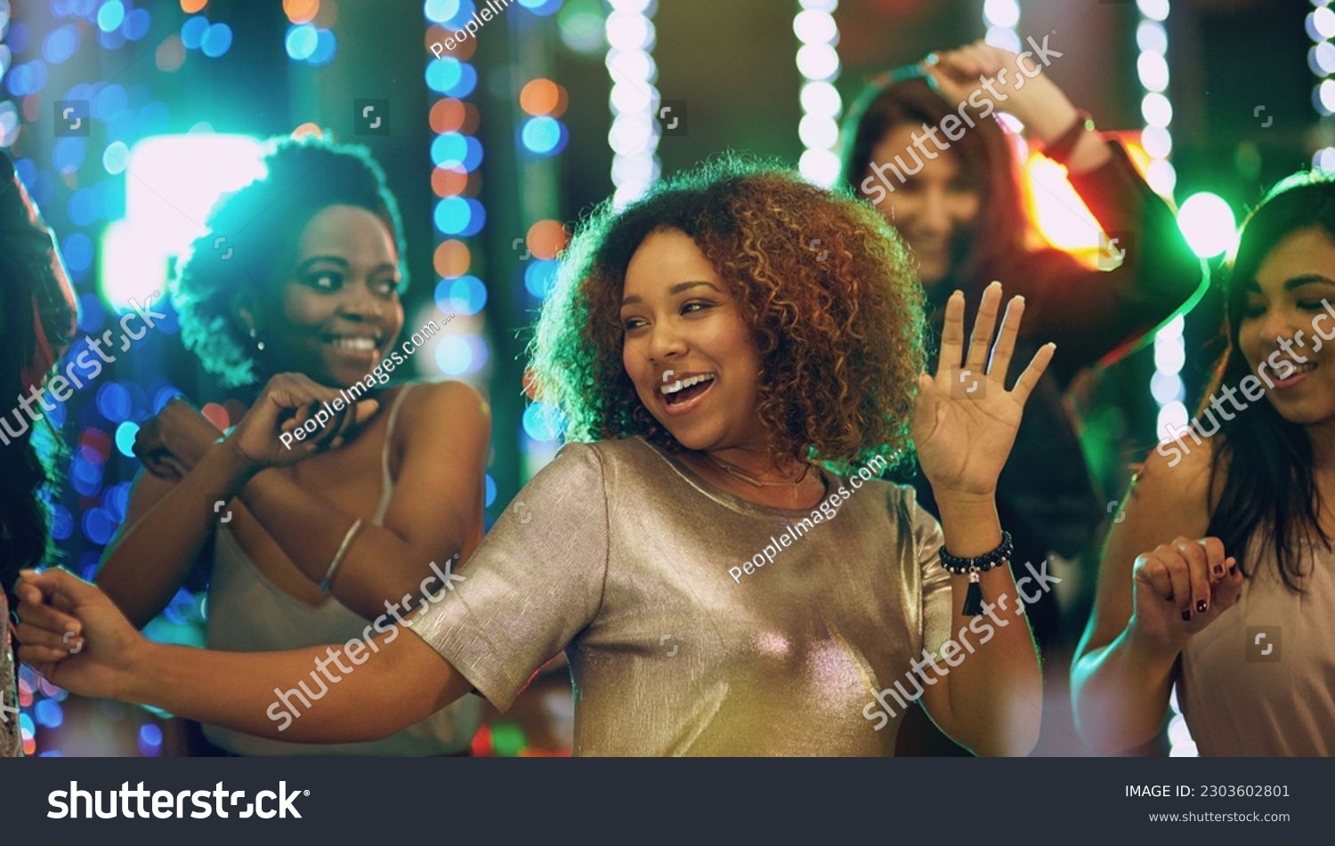 Happy woman, dance and party in nightclub with friends, social event and new year concert. Dancing group, women and disco celebration with music, night life and crowd for energy, smile and happiness #2303602801