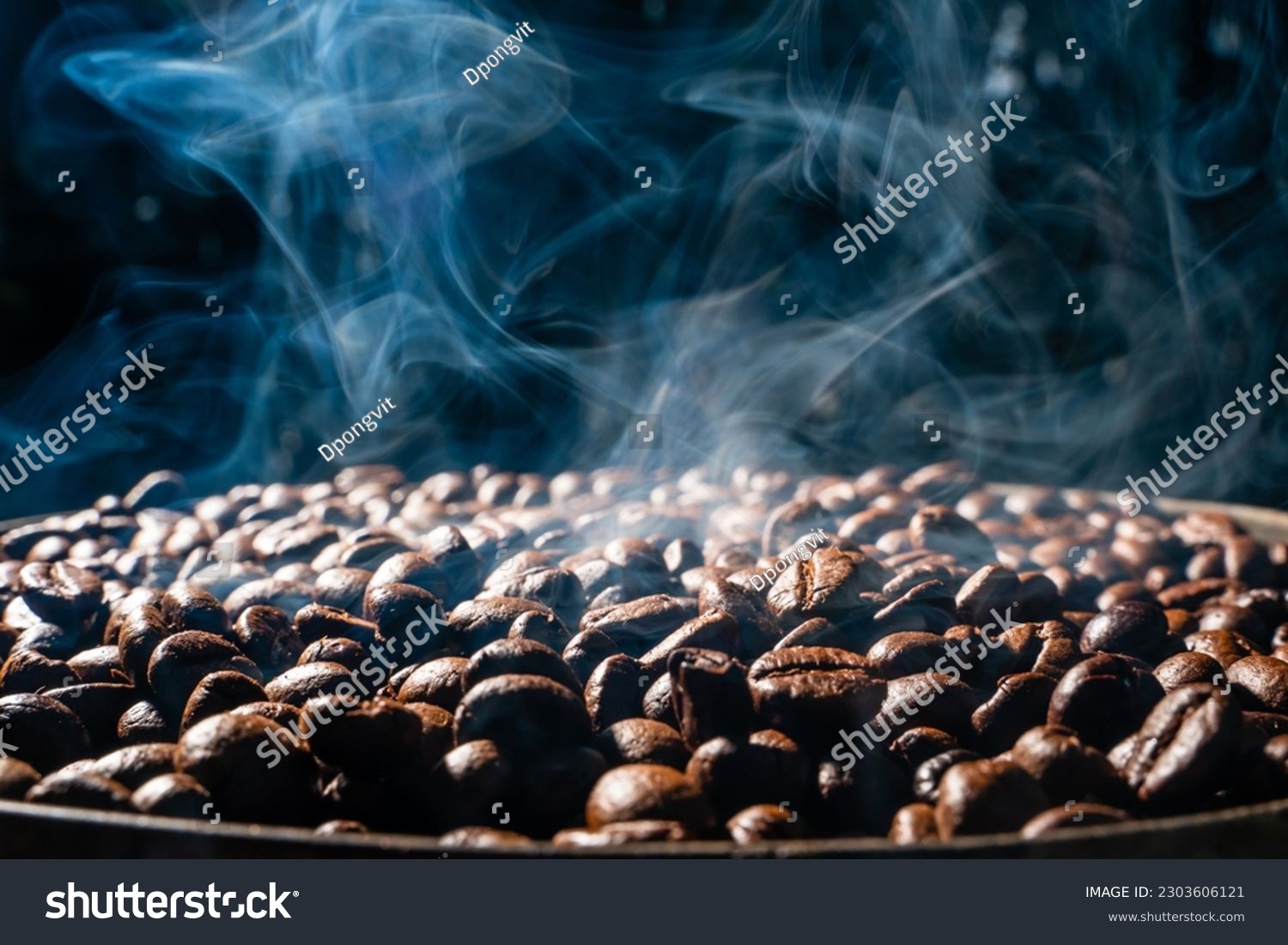Coffee beans roasting with smoke,  selective focus, and soft focus. #2303606121