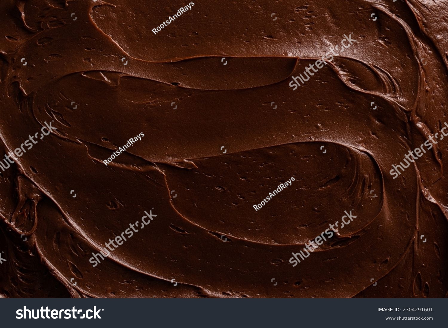 Chocolate icing on a chocolate fudge cake close up.  #2304291601