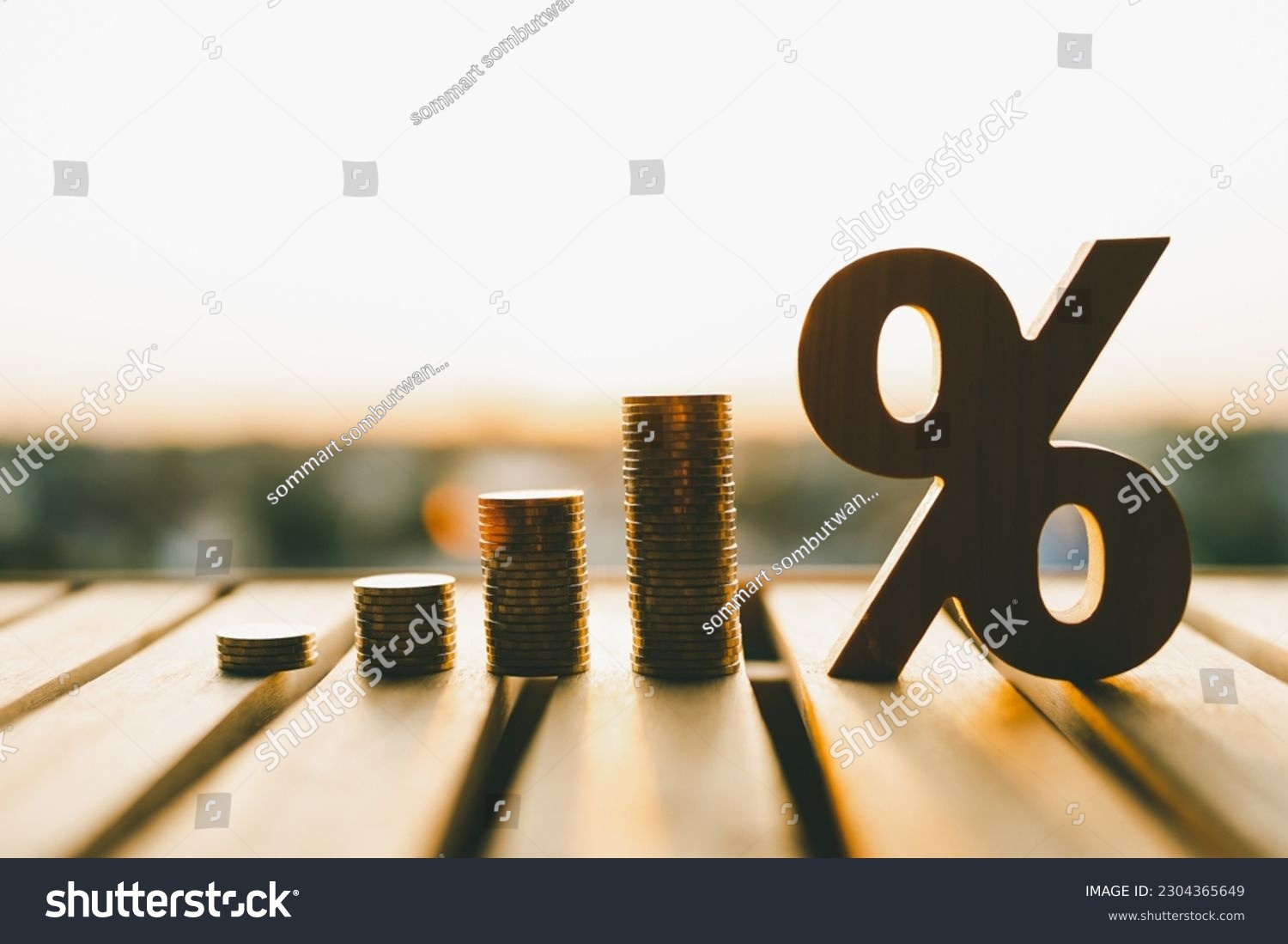 Percentage model with coins stack. Concepts of the banking system, rising interest rates, inflation, deflation, and savings.	 #2304365649
