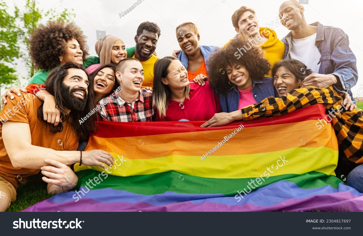 Happy diverse young friends celebrating gay pride day - LGBTQ community concept #2304817697