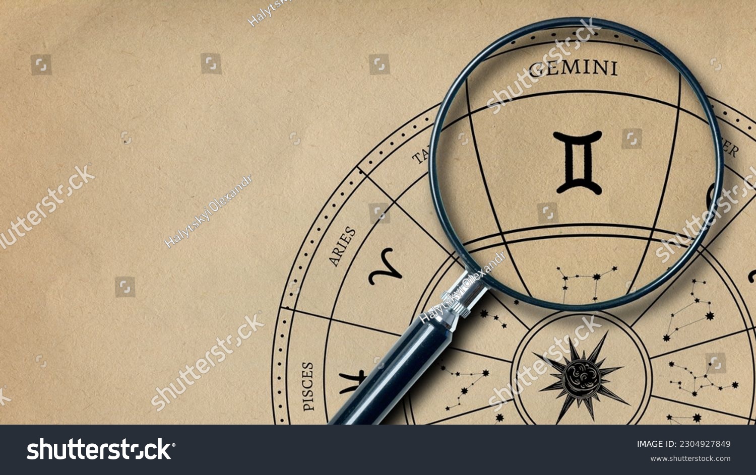 The imprint of the zodiac sign Gemini on old paper is enlarged with a lens #2304927849