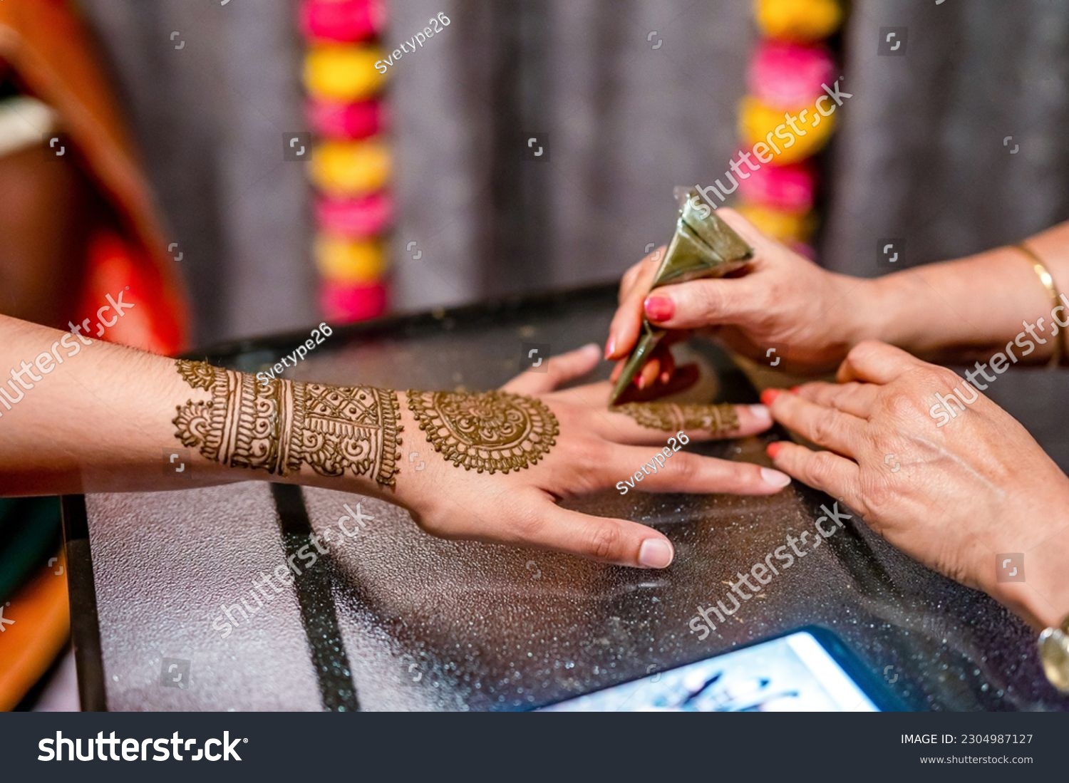 Indian bride's wedding henna mehendi mehndi hands close up #2304987127