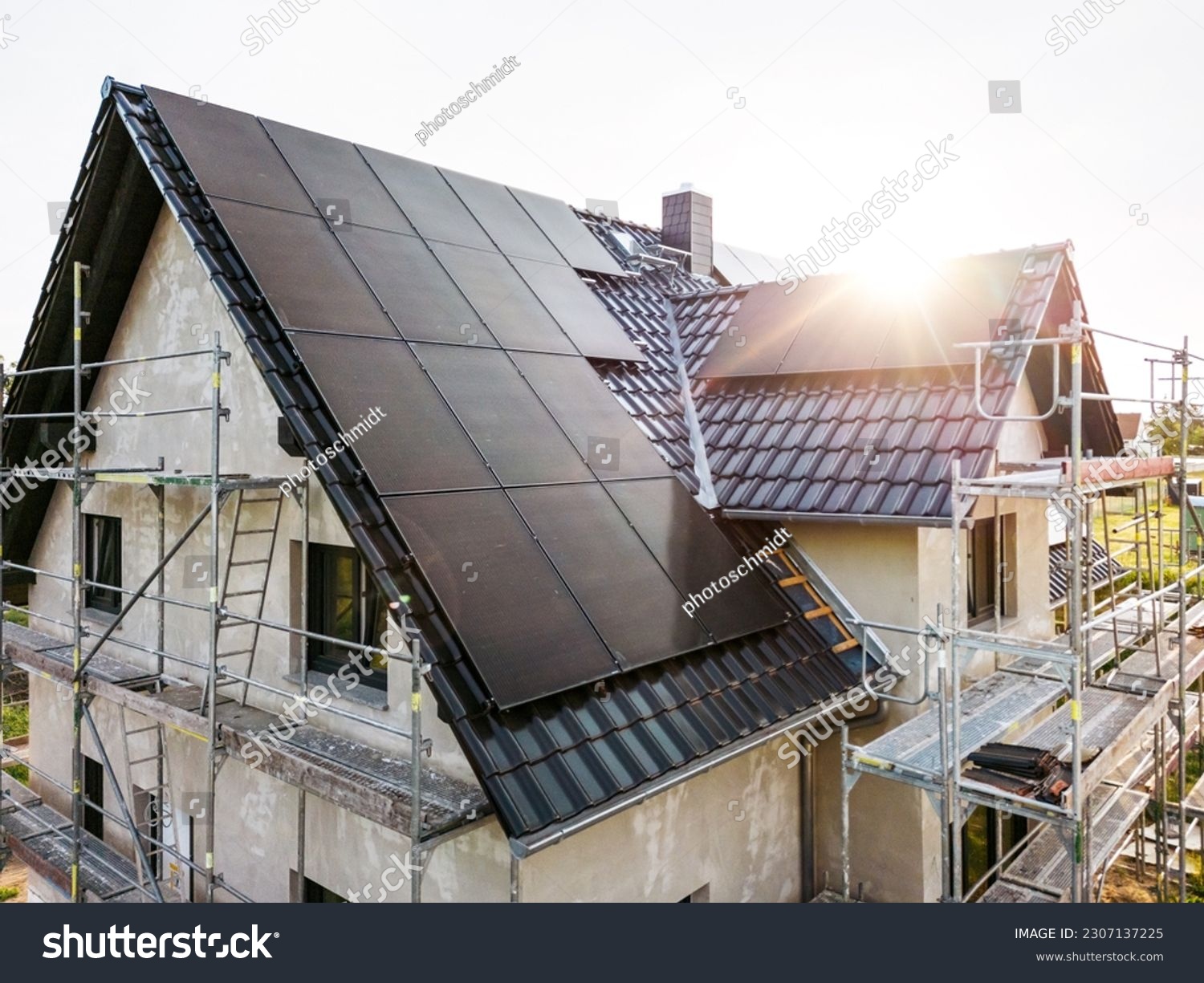 Construction site of a sustainable single family house with solar panels #2307137225