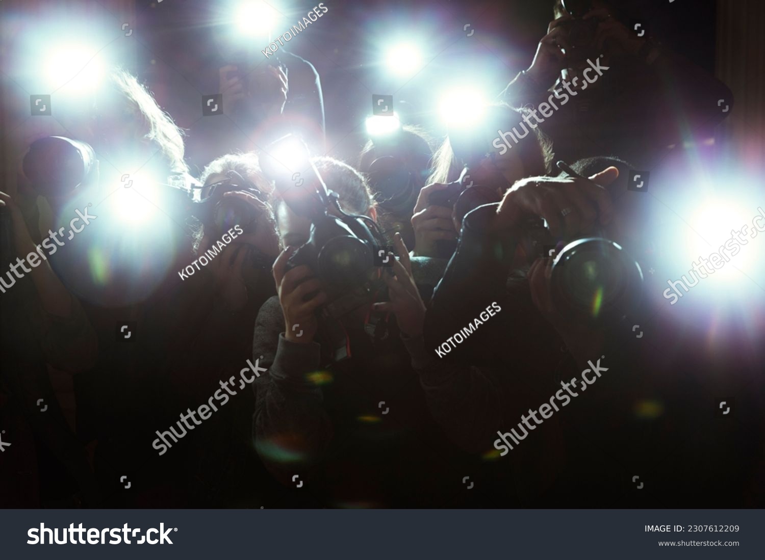 Close up of paparazzi photographers pointing cameras #2307612209