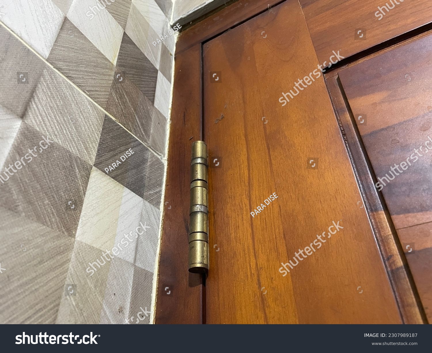 Solo-Surakarta, May 25 2023 Closeup photo of door hinges. #2307989187