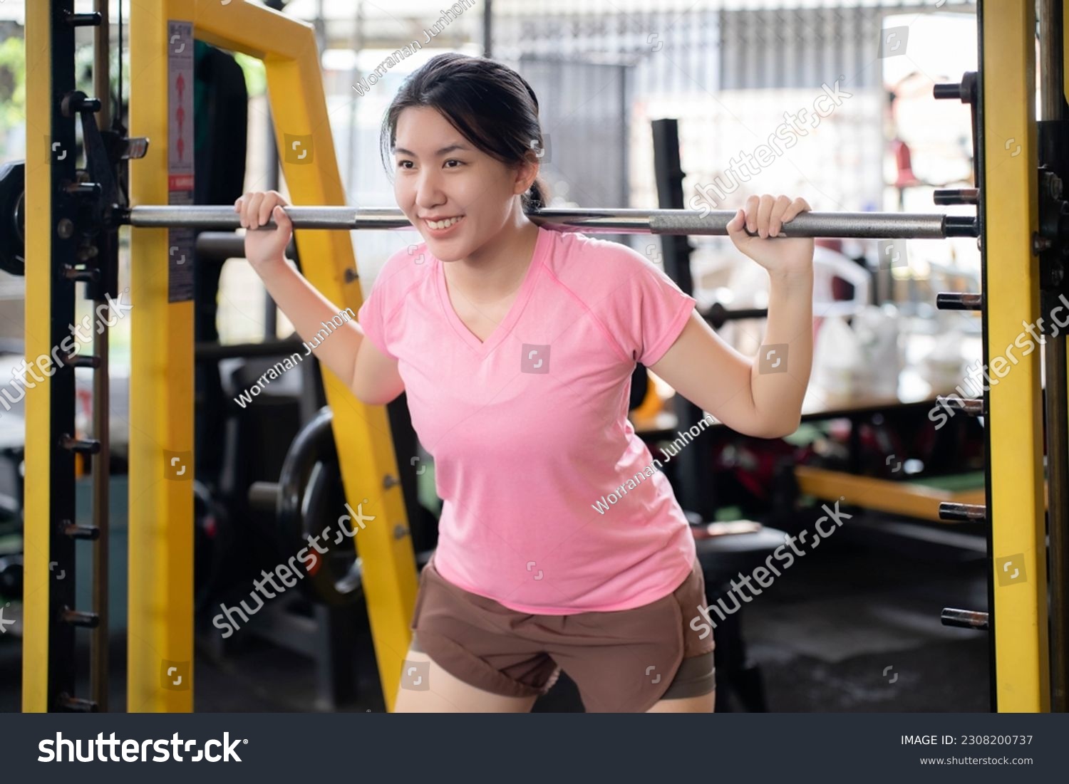 Asian woman exercising to build muscles, toning muscles to keep fit and healthy.Healthcare concept, beginners, self-transformation exercises. #2308200737