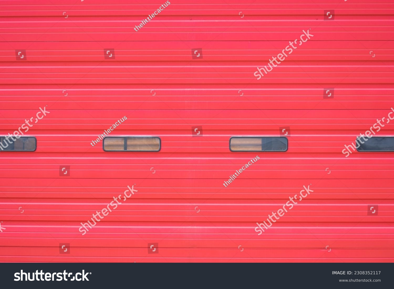 A roll-down firehouse garage door background with space for copy #2308352117