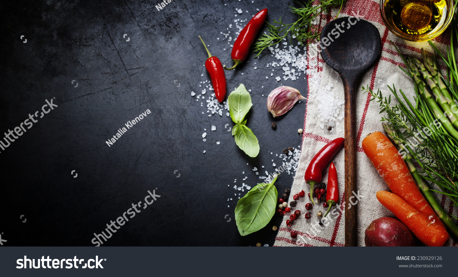 Wooden spoon and ingredients on dark background. Vegetarian food, health or cooking concept. #230929126