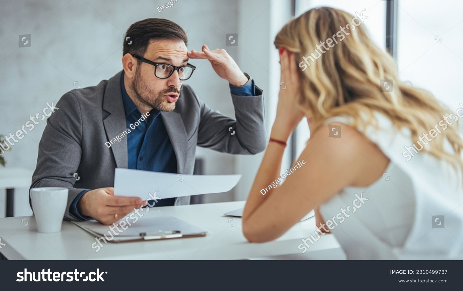 Boss threatening with finger his employee in office. Angry mean boss yelling at employee for missing deadline, executive manager scolding ineffective salesman showing bad work results #2310499787