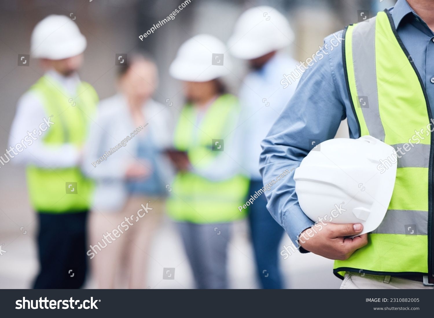 Businessman, architect and helmet for safety in construction, project management or meeting on site. Man holding hard hat for industrial architecture, teamwork or maintenance and building in the city #2310882005