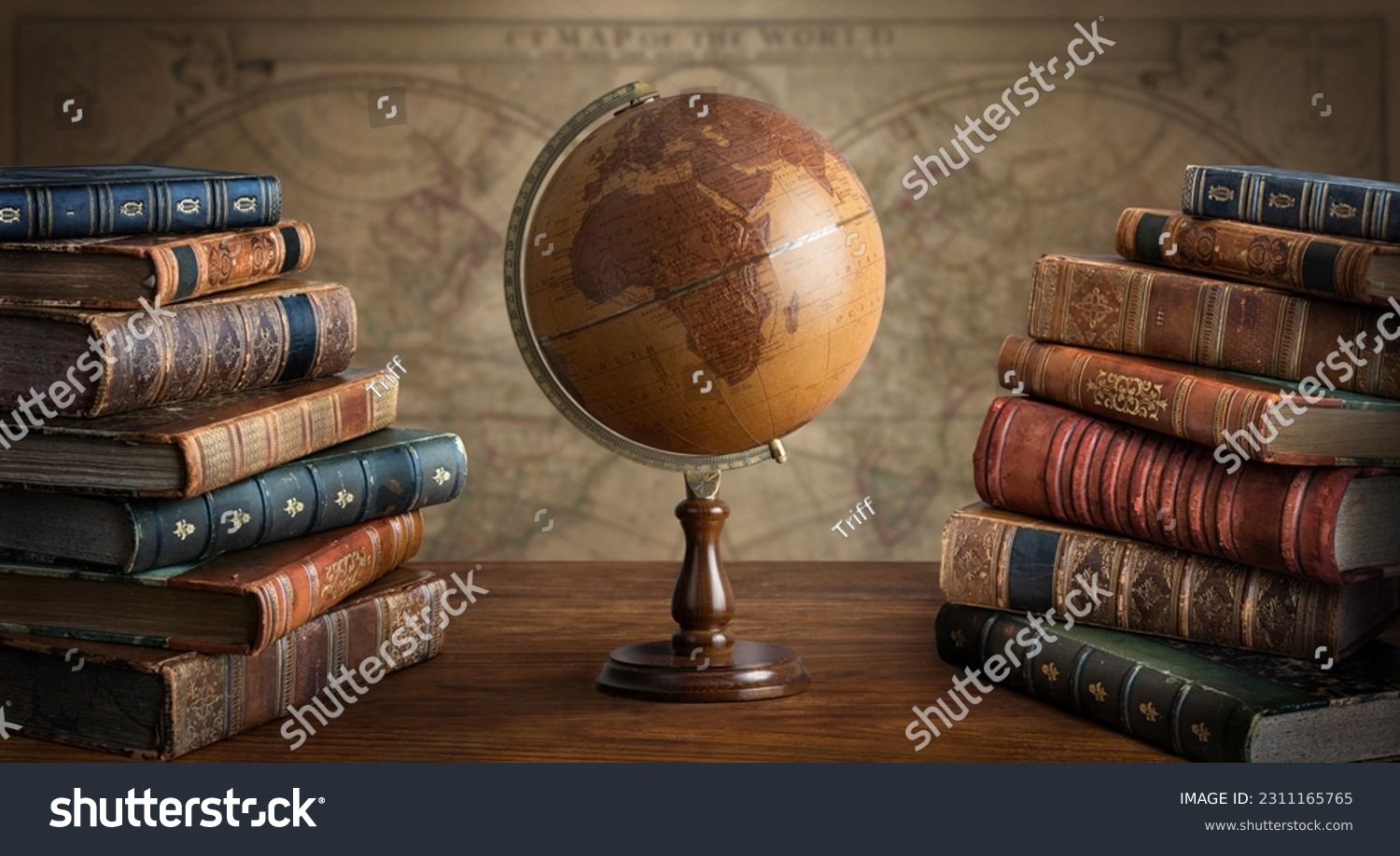 Old geographical globe and map and old book in cabinet. Science, education, travel background. History and geography team. Ancience, antique globe on the background of old map. #2311165765
