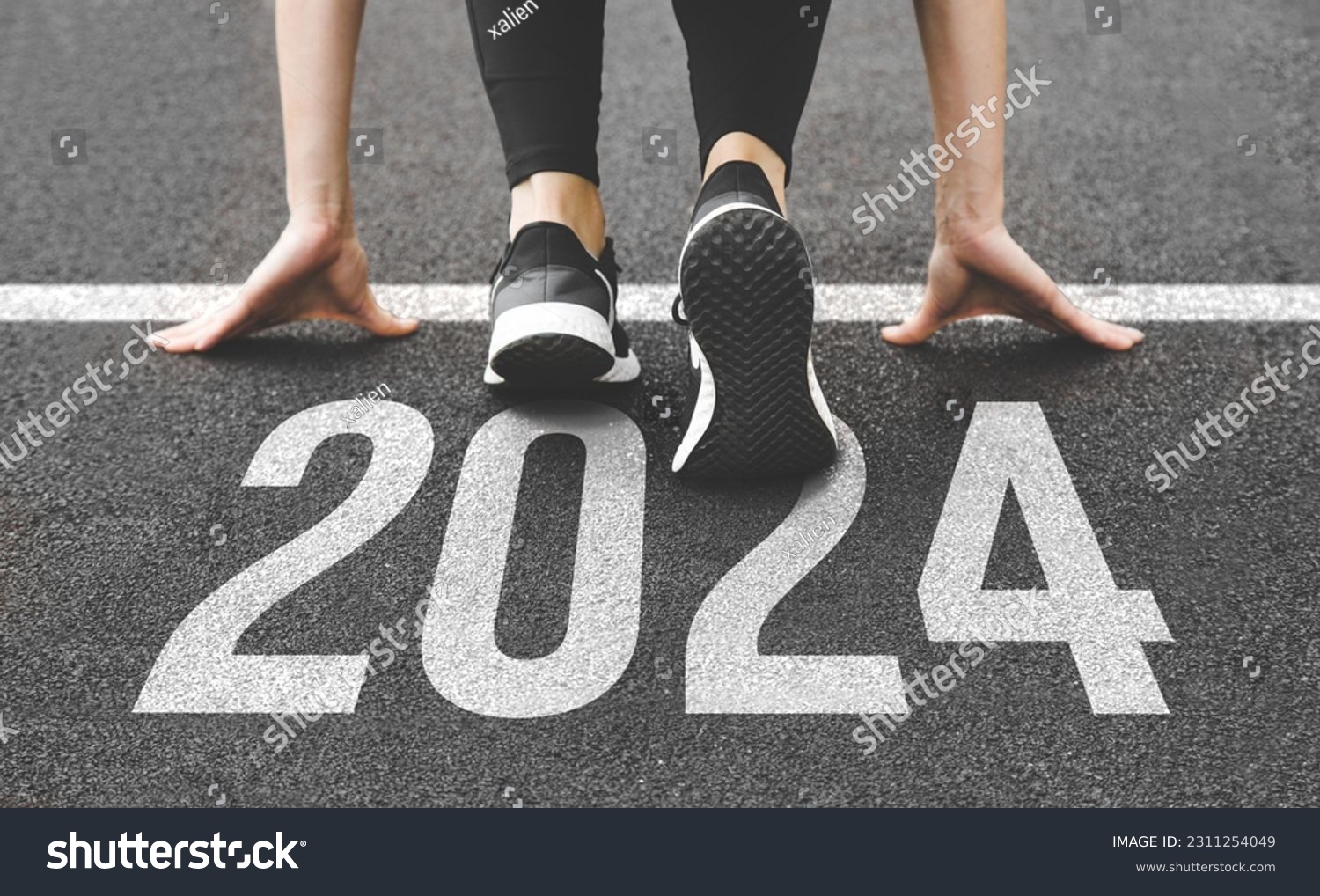 Woman's feet ont the road, begin to run, fstart of New year 2024, planning, goal, and new year resolution. #2311254049