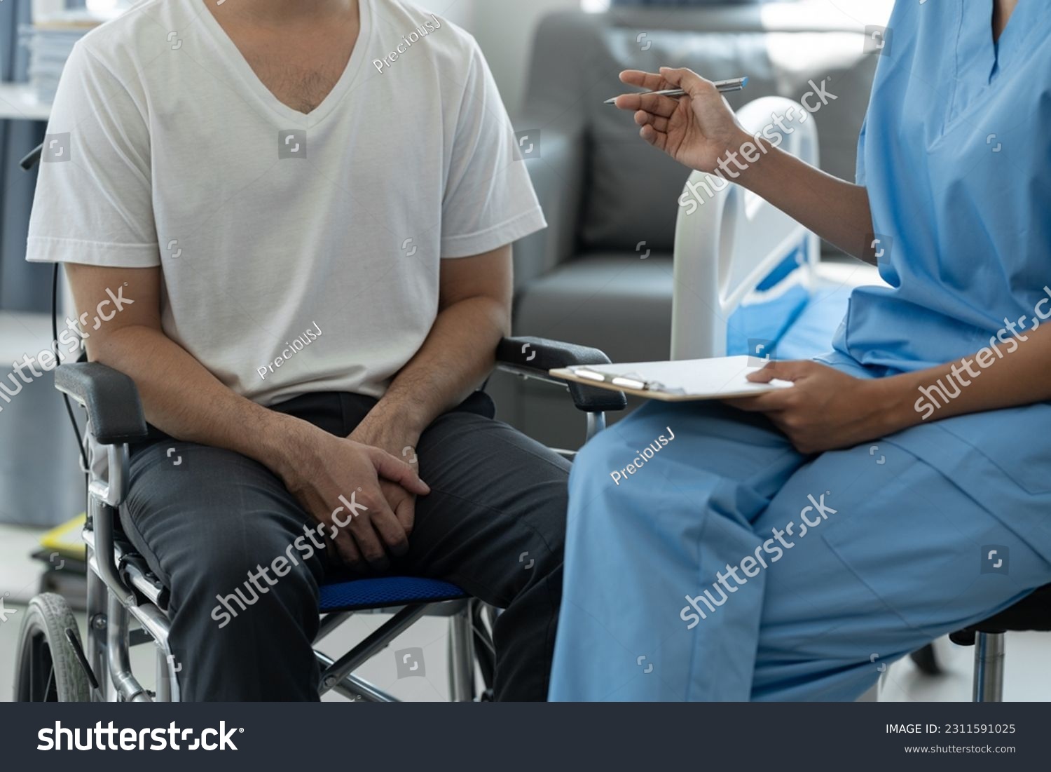 Psychologists or physiotherapists give advice and advice on health care lifestyles for male patients in wheelchairs who have pain in the genital area. and used in everyday life, health insurance. #2311591025