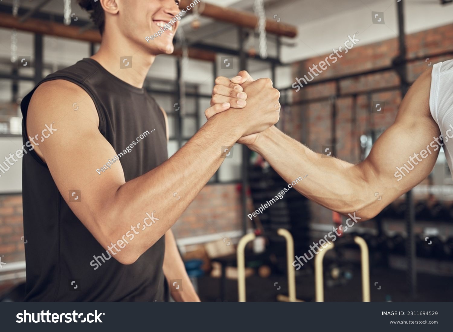Training, handshake and people at a gym for fitness, agreement and deal on blurred background. Sport, friends and men shaking hands for healthy lifestyle commitment, goal and personal trainer support #2311694529