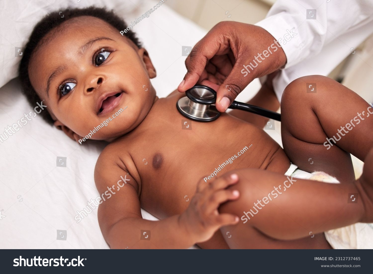 African, little baby and stethoscope in bed for health checkup or pediatrician with infant or healthcare clinic and medical wellness. Child patient, cardiology and expert with toddler in hospital #2312737465