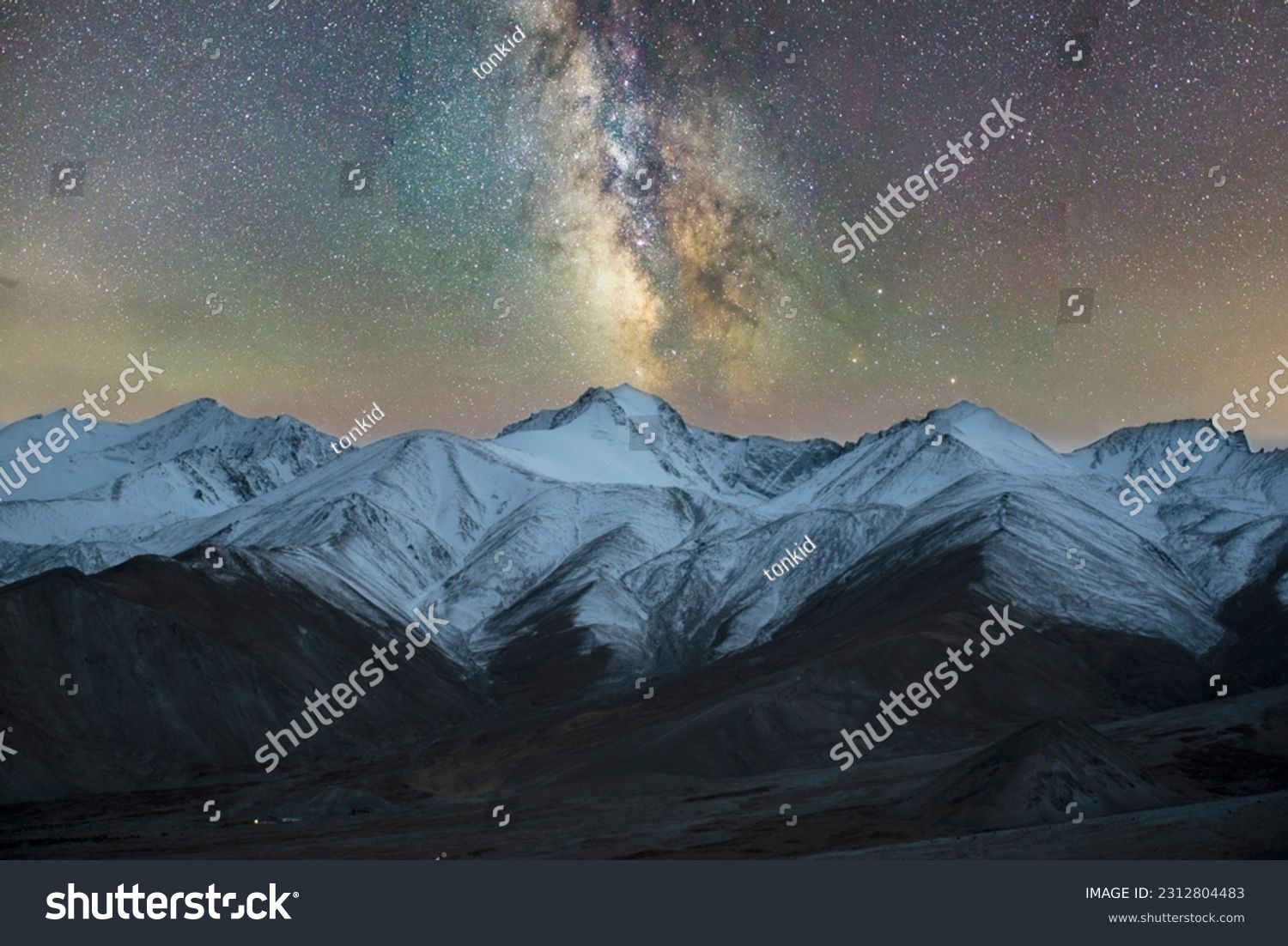 Arching Milky Way galactic center over the mountain at Pangong Lake or Pangong Tso, Ladakh, Jammu and India. #2312804483