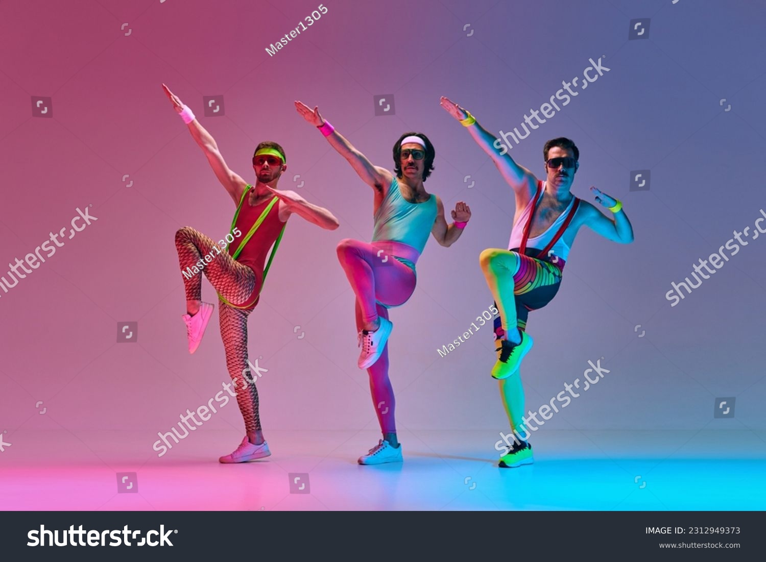Athletic, funny men in retro colorful sportswear training, doing exercises against gradient blue pink studio background in neon light. Concept of sportive and active lifestyle, humor, retro style. Ad #2312949373