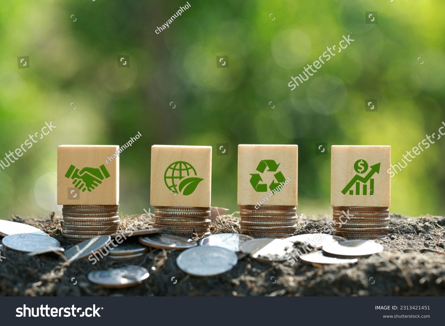 Green icons on wooden cubes on money coin stack. Green business growth. Finance sustainable development.growing money, finance and investment. Alternative sources of energy. Eco business investment #2313421451