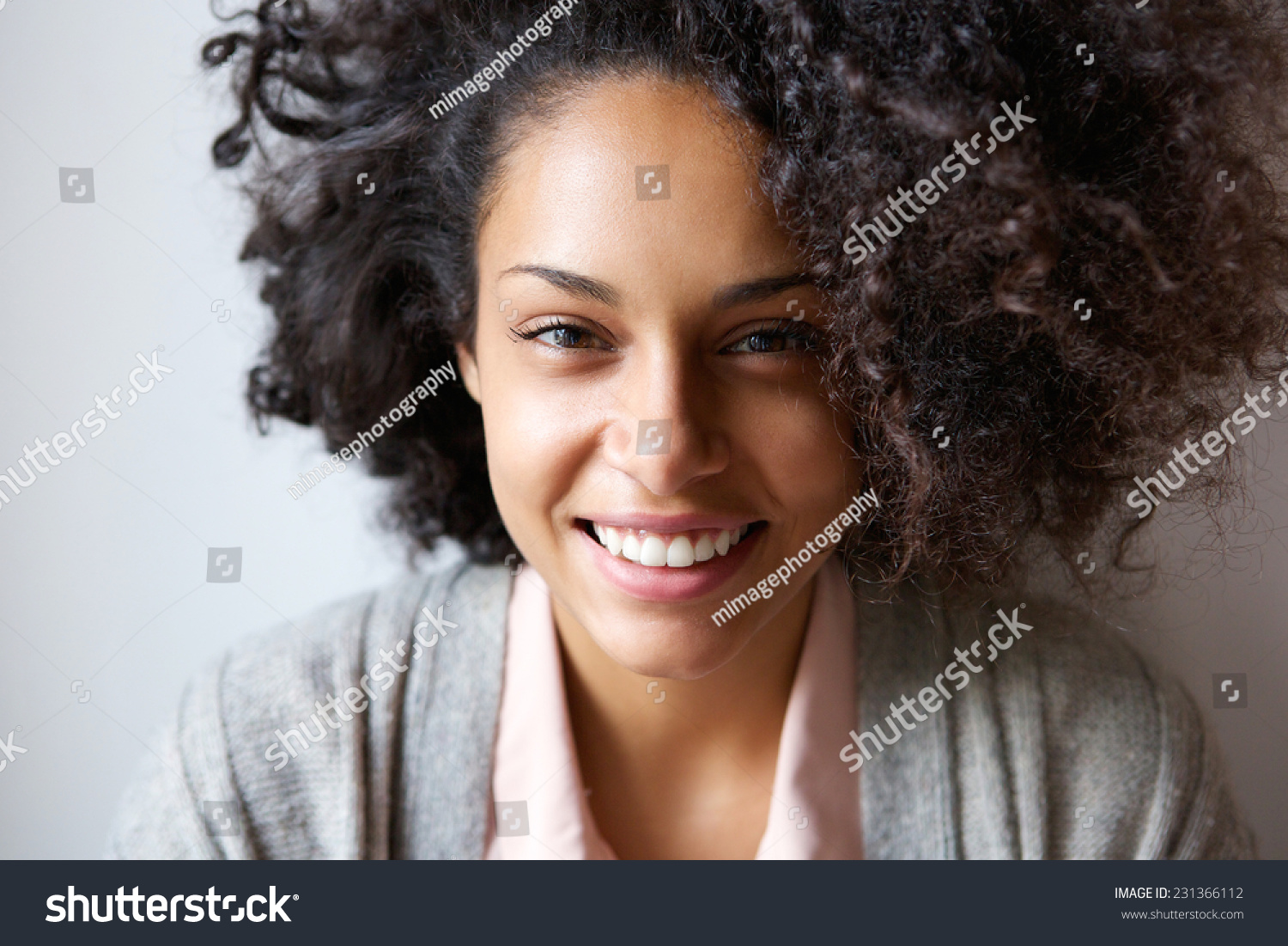 Close up portrait of a beautiful young african american woman smiling #231366112