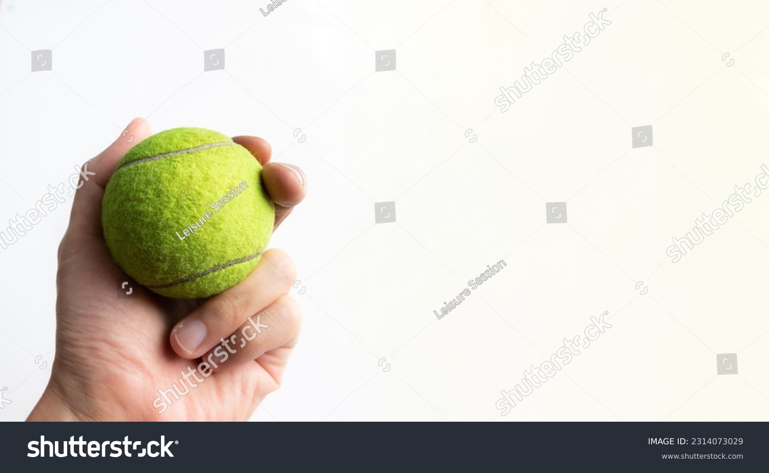 Hand holding a tennis ball, after some edits. #2314073029