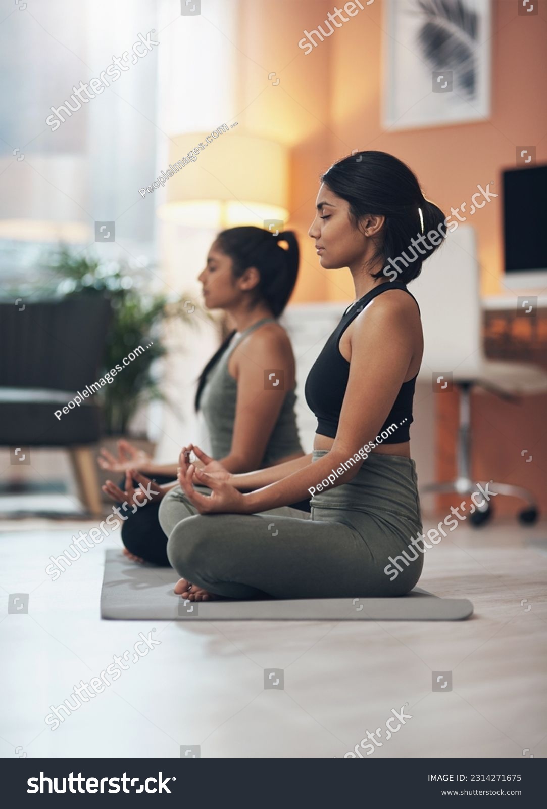 Friends, meditation and zen women together in a house for mindfulness, health and relax wellness. Indian sisters or female family meditate in lounge for yoga, lotus and mental health balance at home #2314271675