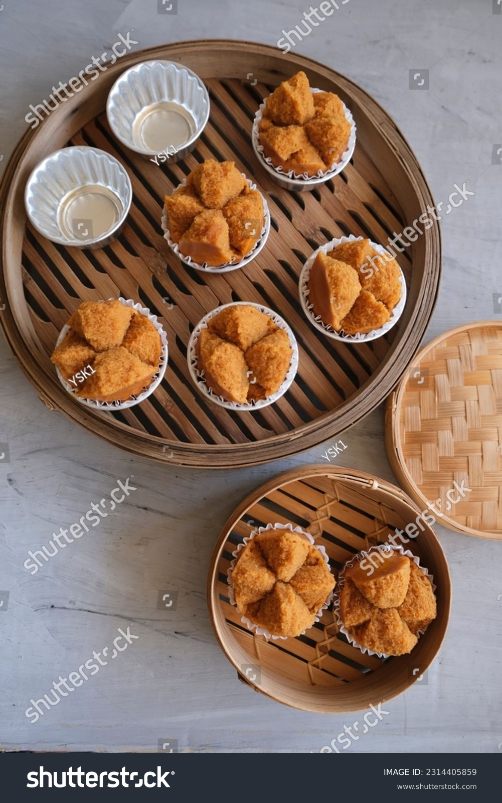 Popular Chinese pastry. Fa Gao aka Prosperity Cake. Color comes from brown sugar and the Chinese character in the red packet symbolised "prosperity" #2314405859