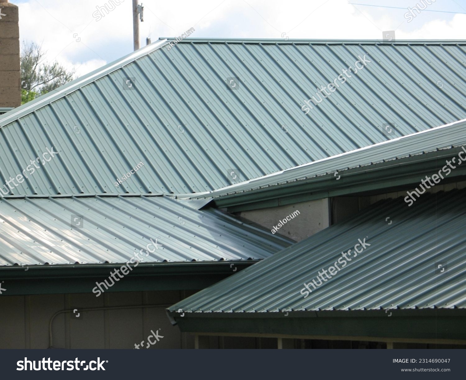 a green metal roof in the sun  #2314690047