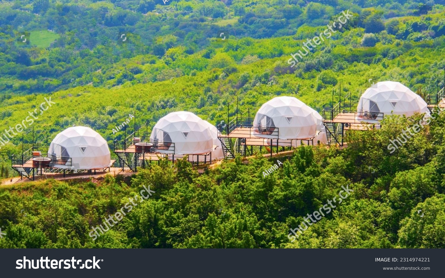 Domed houses in Georgia on the background of a green forest. Eco friendly construction, sustainable development. #2314974221