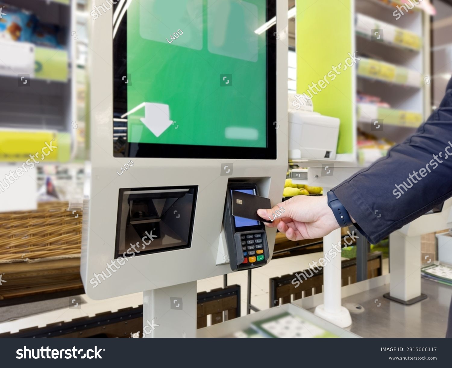 Customer pays his purchase at the supermarket,self checkout systems in  retail stores,Barcode scanner,Self checkout machine #2315066117