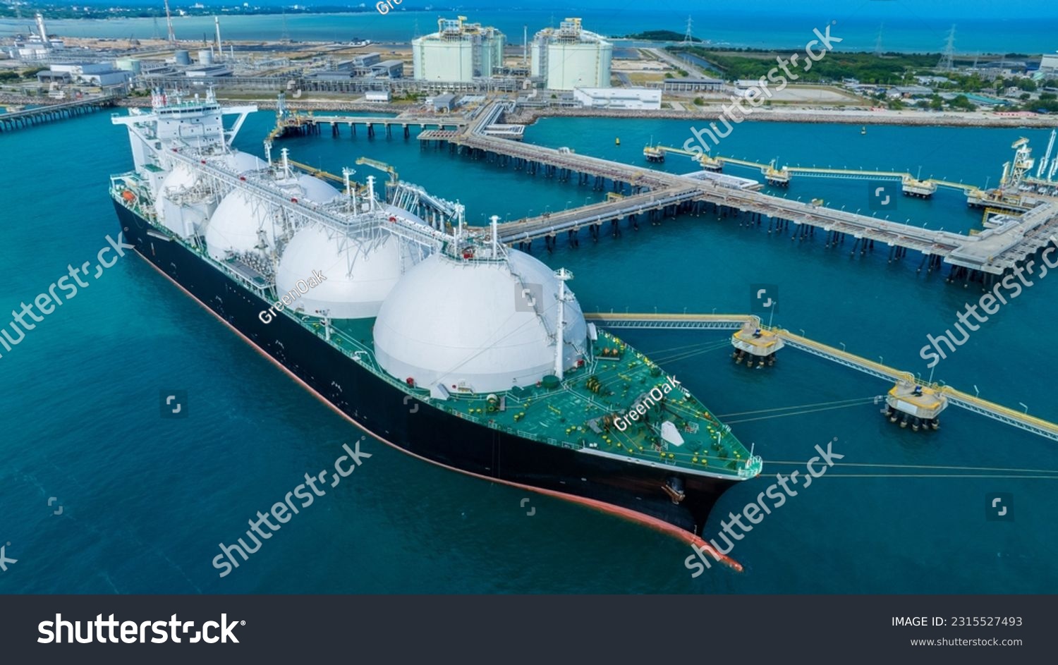 LNG (Liquified Natural Gas) tanker anchored in Gas terminal gas tanks for storage. Oil Crude Gas Tanker Ship. LPG at Tanker Bay Petroleum Chemical or Methane freighter export import transportation  #2315527493