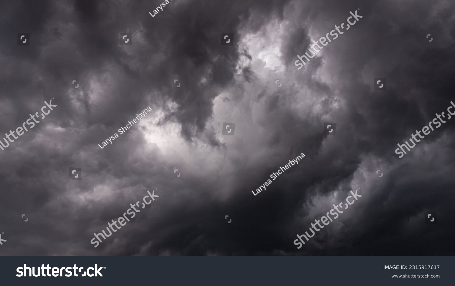 Dramatic black and white sky before a thunderstorm. Heavenly landscape. Cold Weather. Rainy season. Wrath of heaven. God is angry. Thunder and lightning. Beautiful stormy clouds. #2315917617