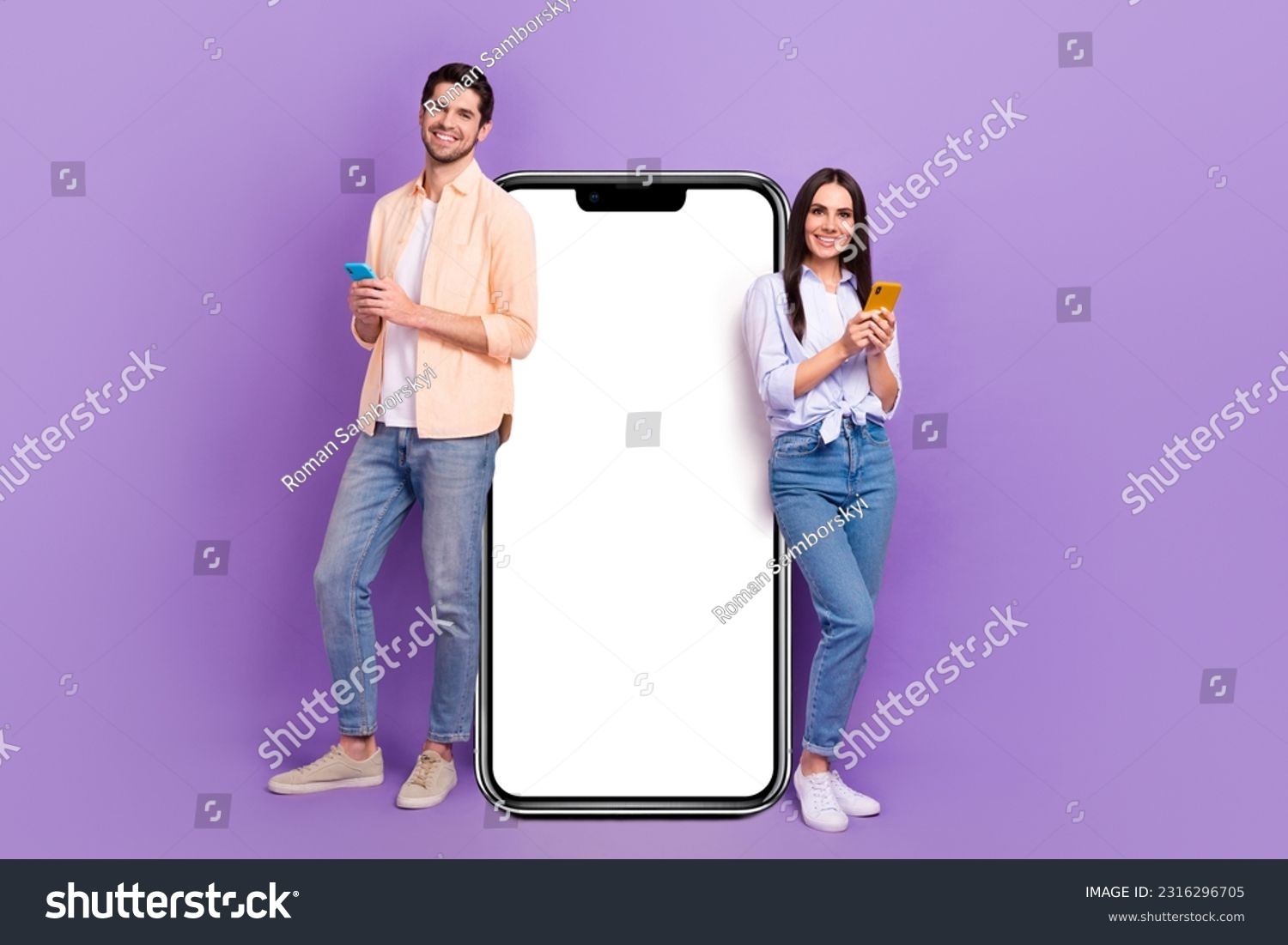 Full size portrait of two nice cheerful people use smart phone big empty space poster isolated on purple color background #2316296705