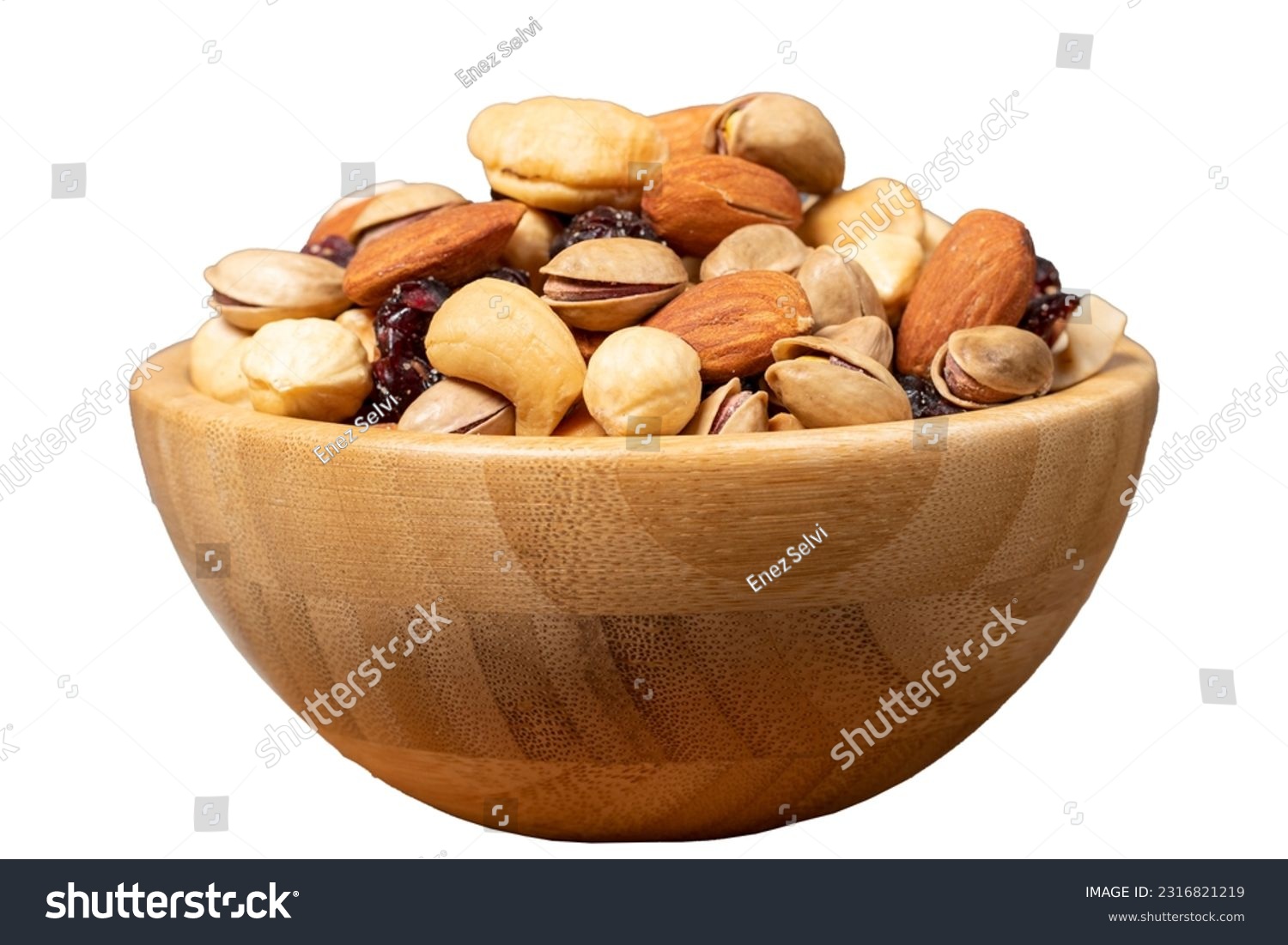 Mixed nuts isolated on white background. Special mixed nuts in wooden bowl. Hazelnut, almond, cashew, pistachio, dried blueberry. Superfood. Vegetarian food concept. healthy snacks #2316821219