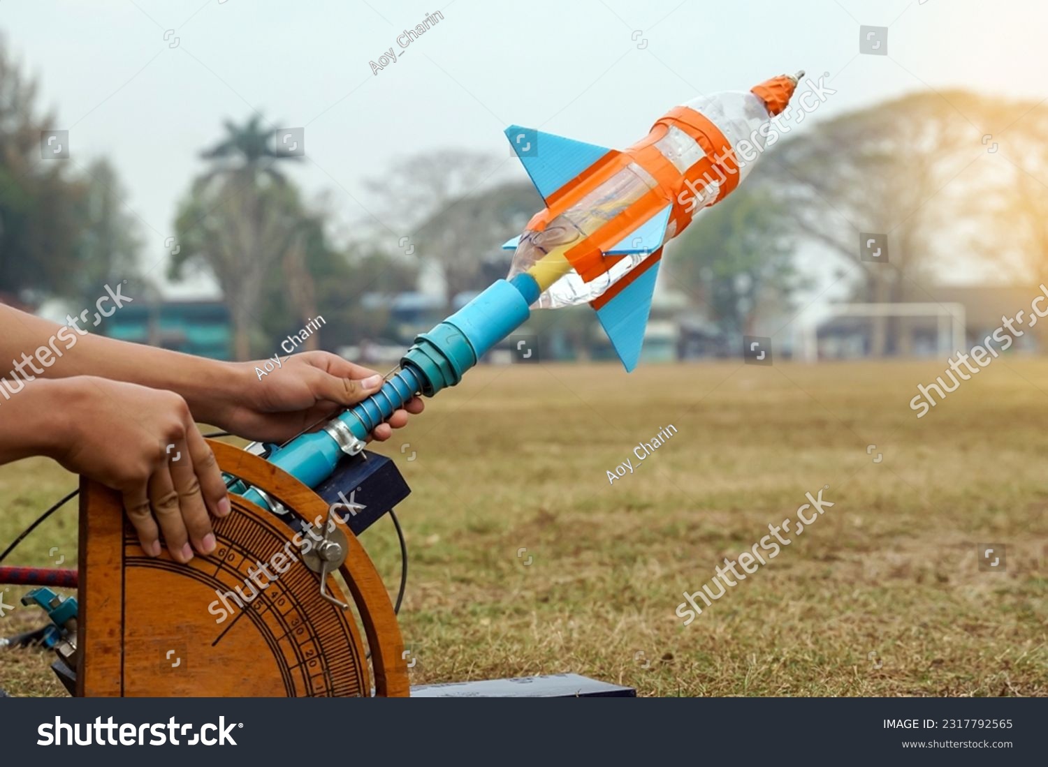 water rocket on launch pad. It is an activity that promotes science knowledge and skills for children. Children have thinking skills, problem-solving, creativity, happiness, and fun.                   #2317792565