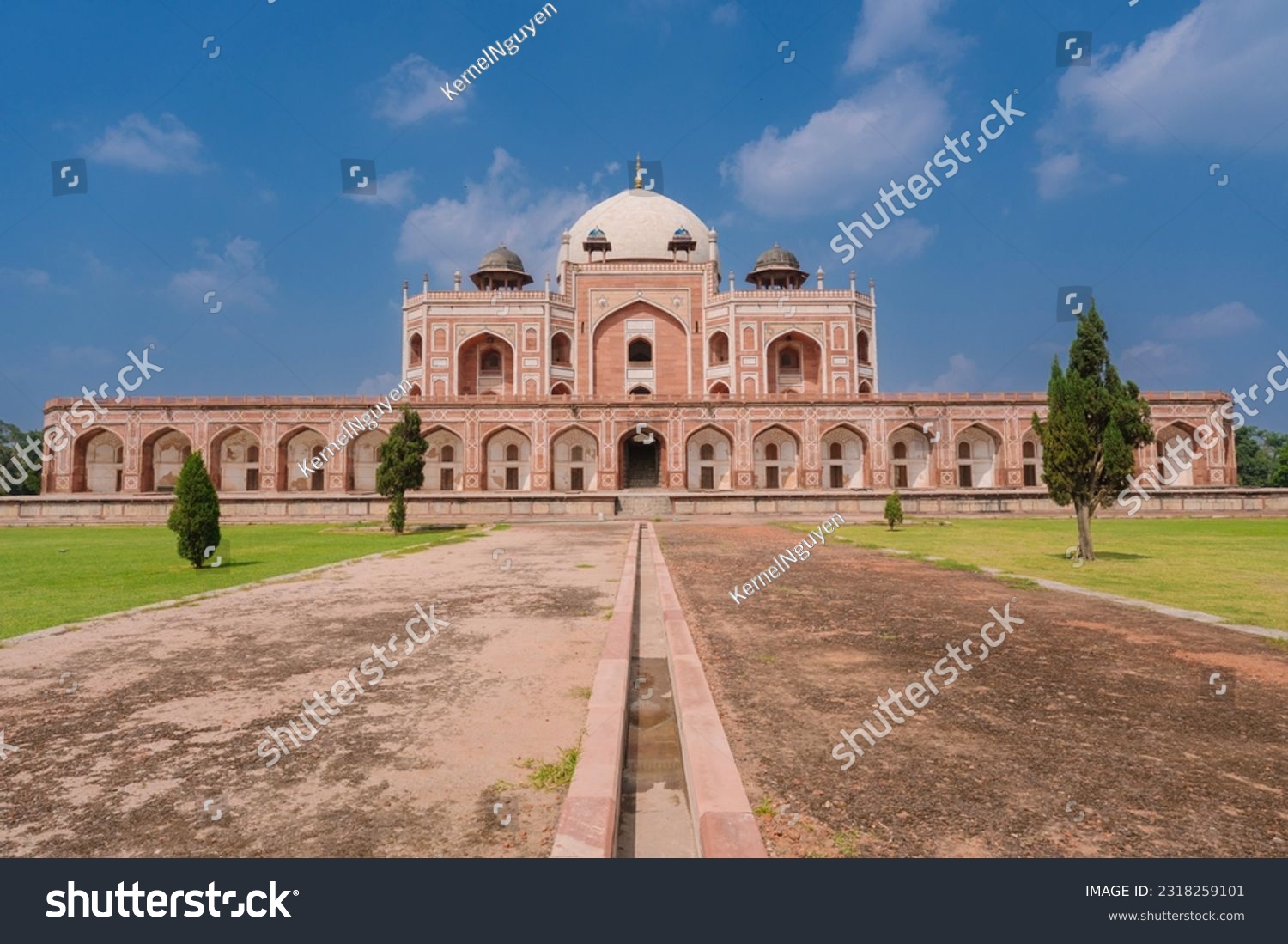 Large lawn in front Humayun's Tomb and the blue sky. Humayun's tomb is the tomb of the Mughal Emperor Humayun in Delhi, India. #2318259101