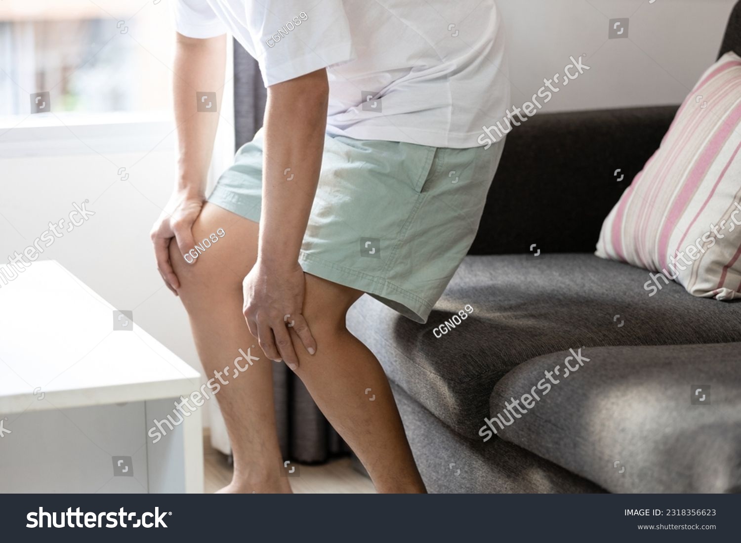 Middle aged man holding knees,pain in kneecap or muscles around knee joint,patella friction against the thigh bone,standing up with difficulty,disease of Runner's knee or Patellofemoral pain syndrome #2318356623
