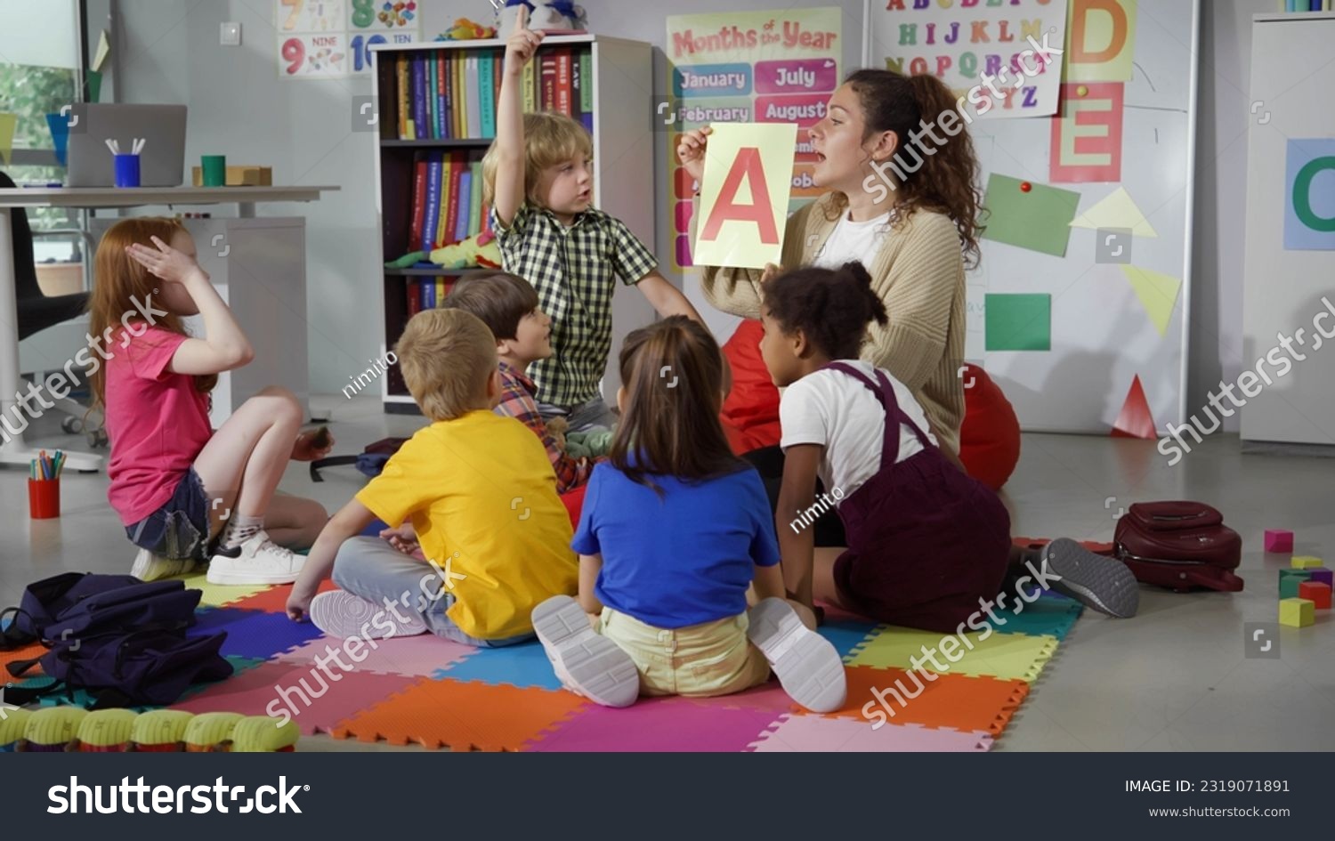 Female teacher hold flashcard with letter a - Royalty Free Stock Photo ...