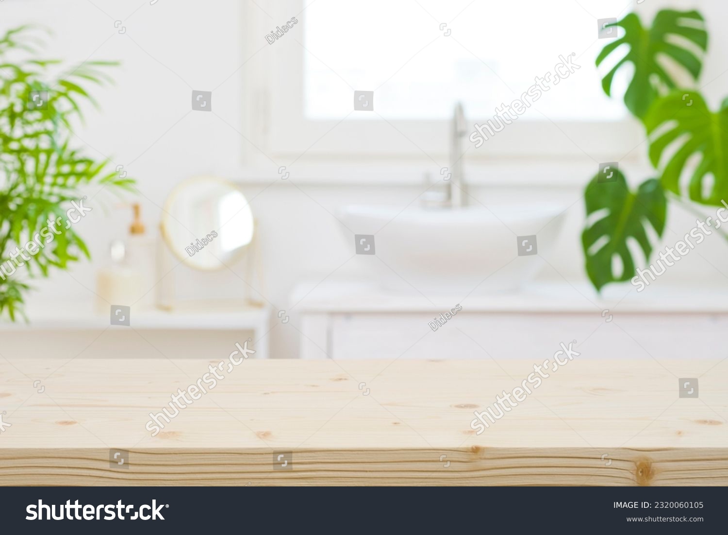 Wooden table top and defocused bathroom sink counter as background #2320060105