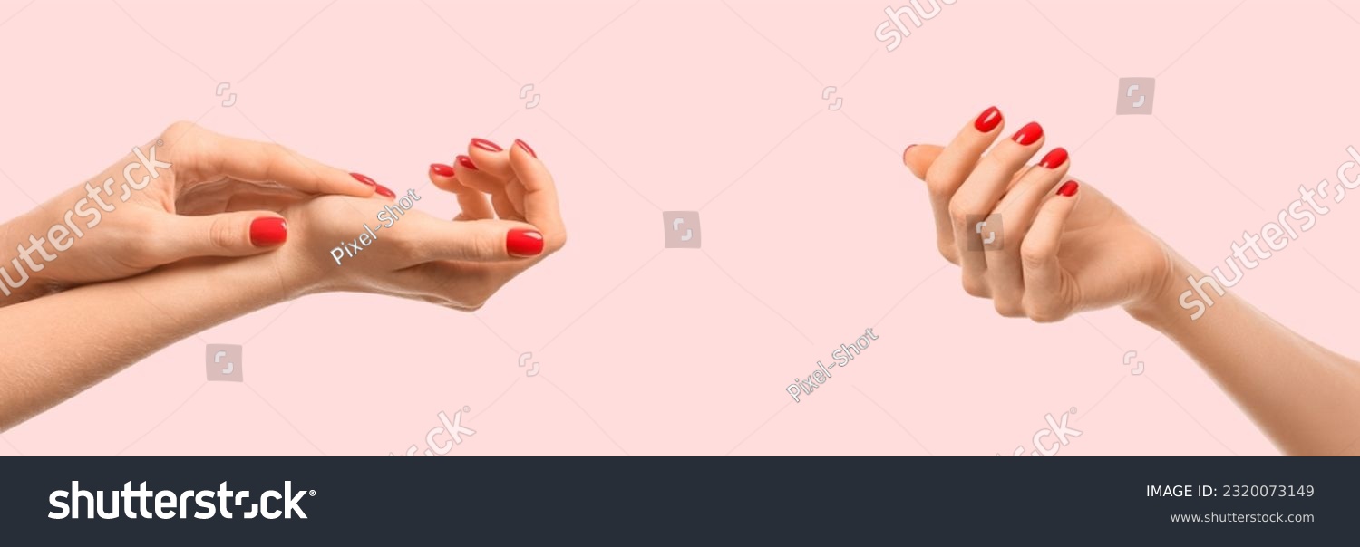 Female hands with red manicure on light pink background. Banner for design #2320073149