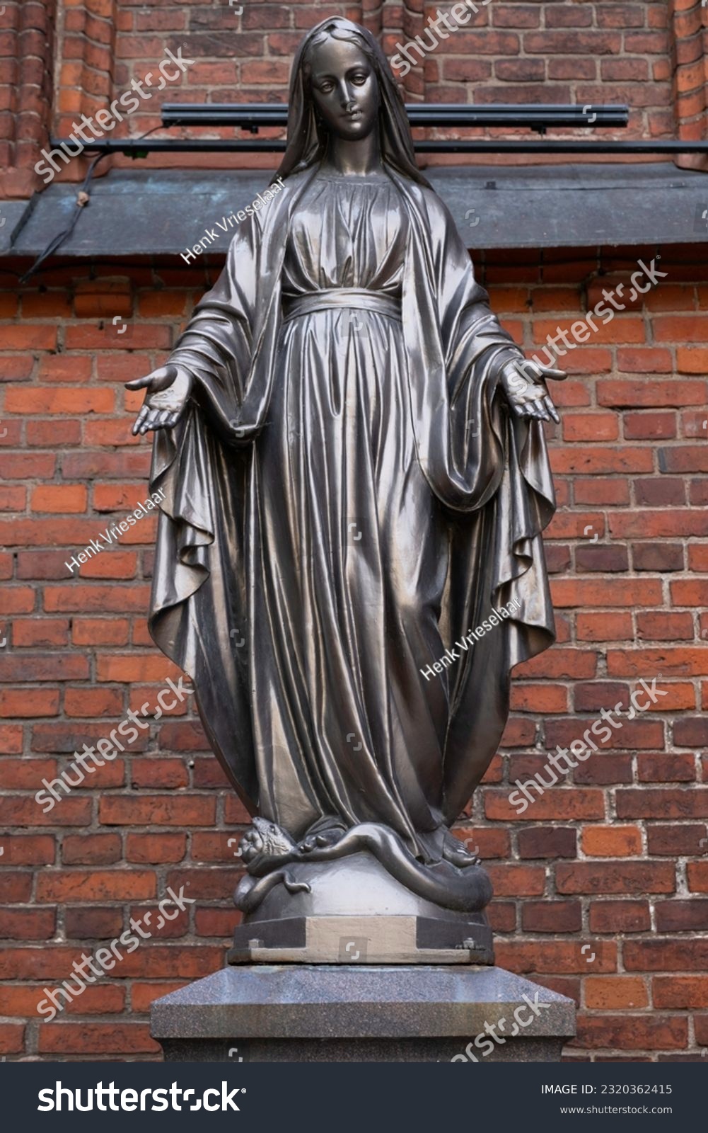Bronze statue of Virgin Mary Immaculate outside of the Cathedral Basilica of apostles St. Peter and St. Paul of Kaunas, Lithuania #2320362415