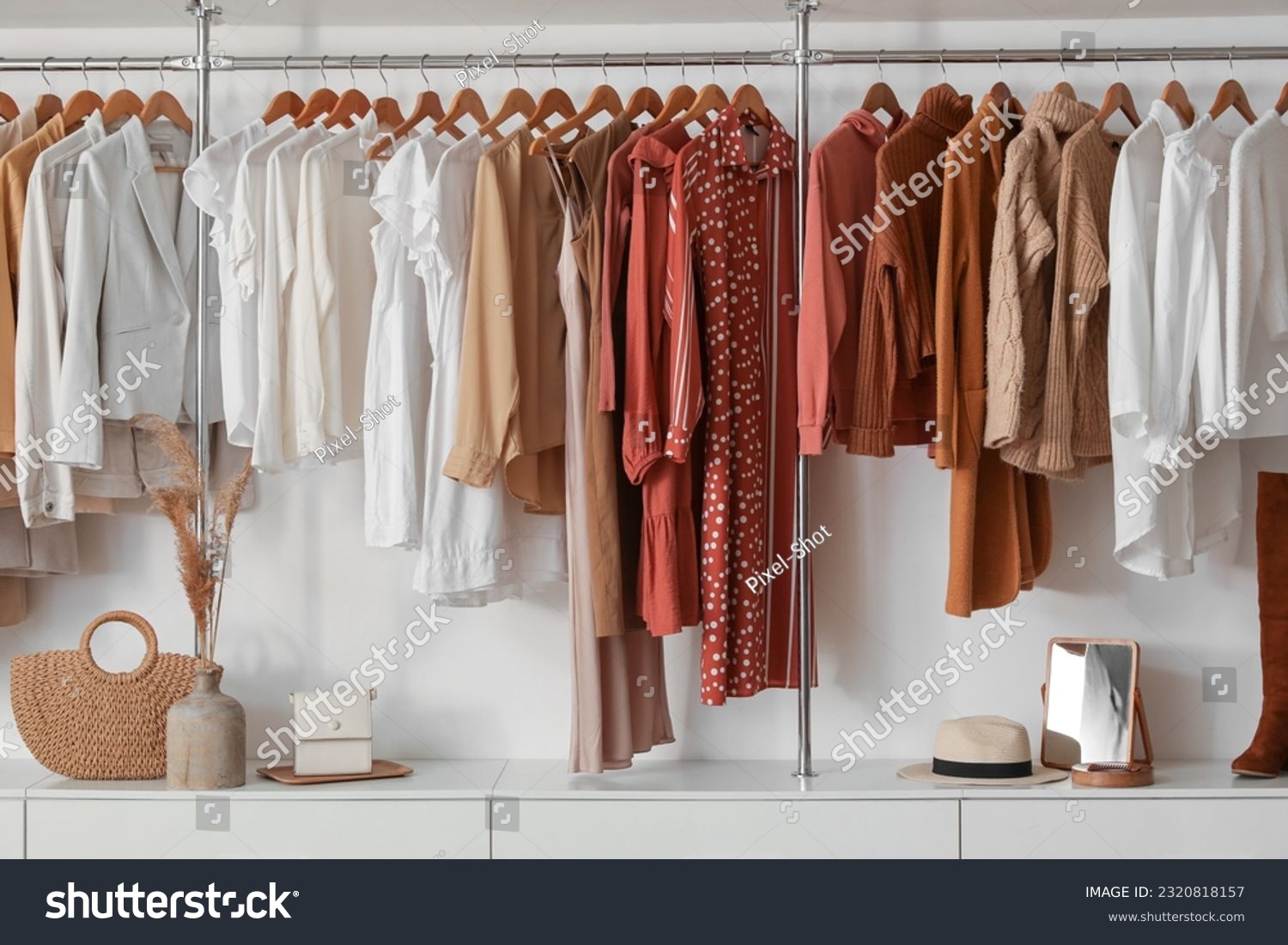 Stylish female clothes hanging in boutique #2320818157