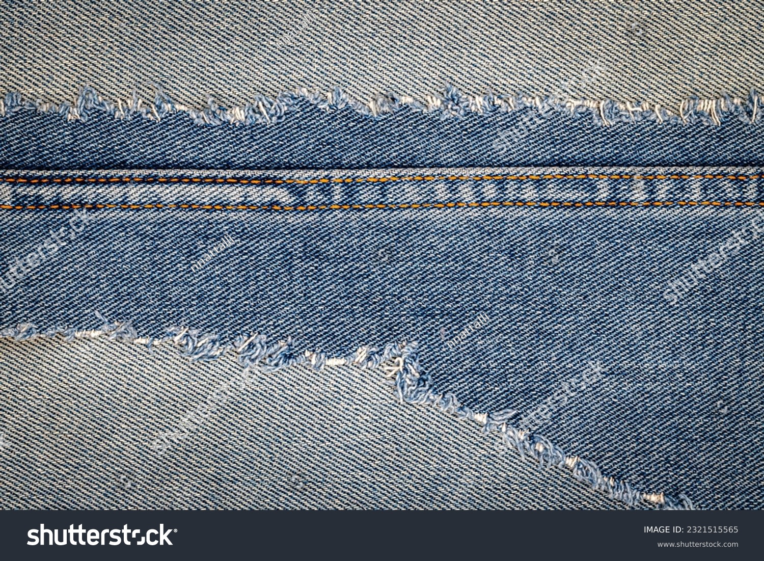 Denim blue jeans fabric frame. Ripped denim fabric. Destroyed torn denim blue jeans patch. Recycle old jeans denim piece. Seam fragment of jeans pants cloth. #2321515565
