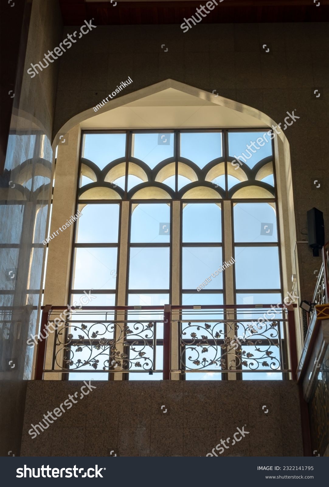 The sunshine lights through the glass window frame and there have wrought iron decorative rails patterns in the corridor. Architecture of Interior Building is built for the Islamic Affairs.art concept #2322141795