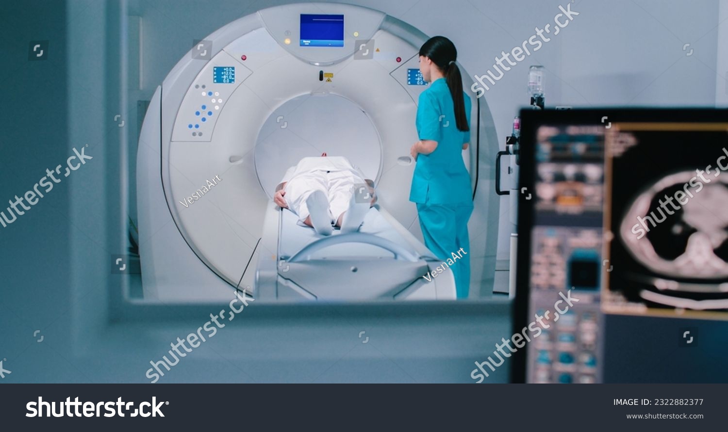 Nurse send patient to MRI capsule on moving table. Magnetic resonance imaging of brain. Room of examinaning with medical equipment. #2322882377