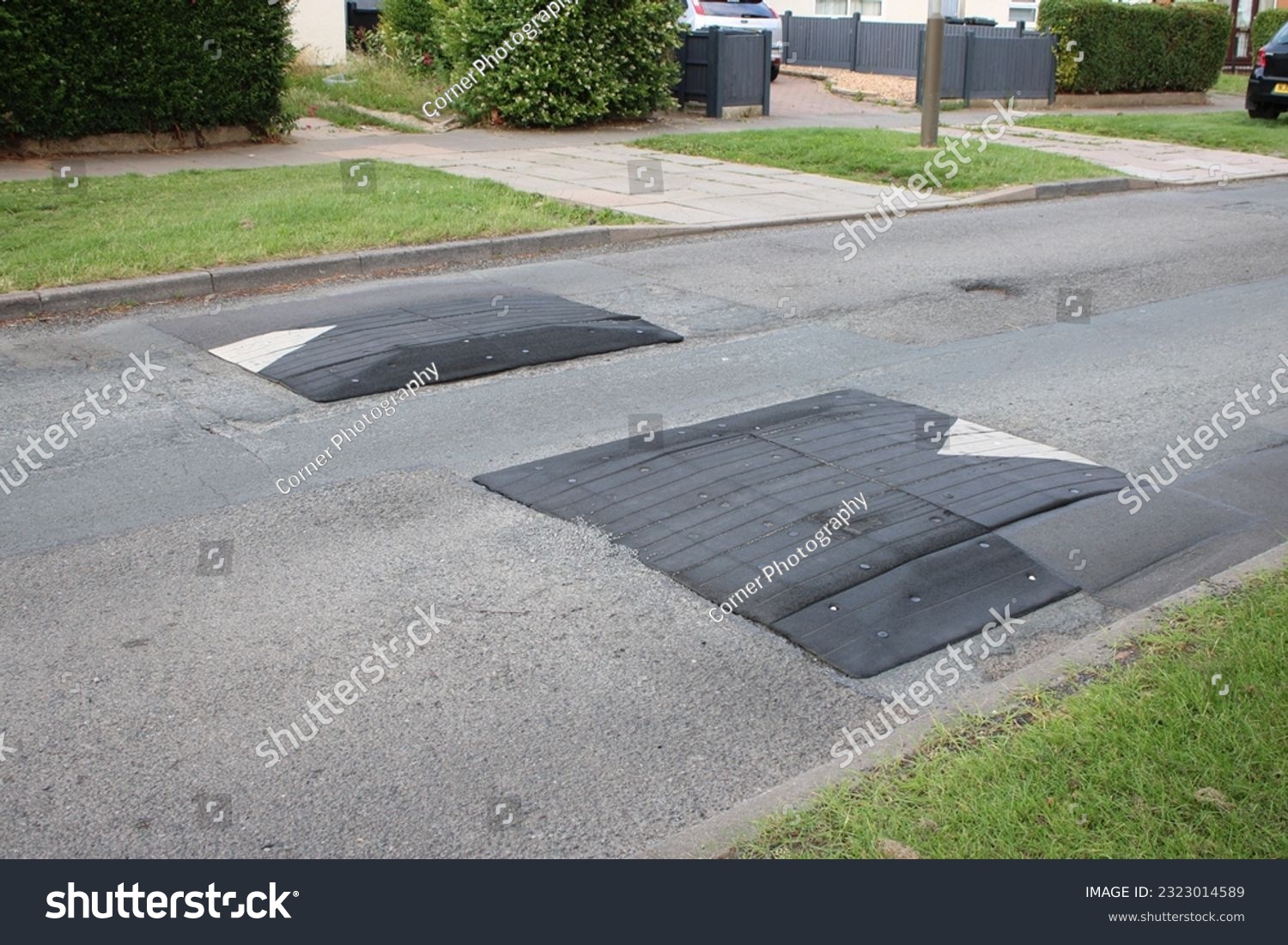 Speed bumps on a residential road #2323014589