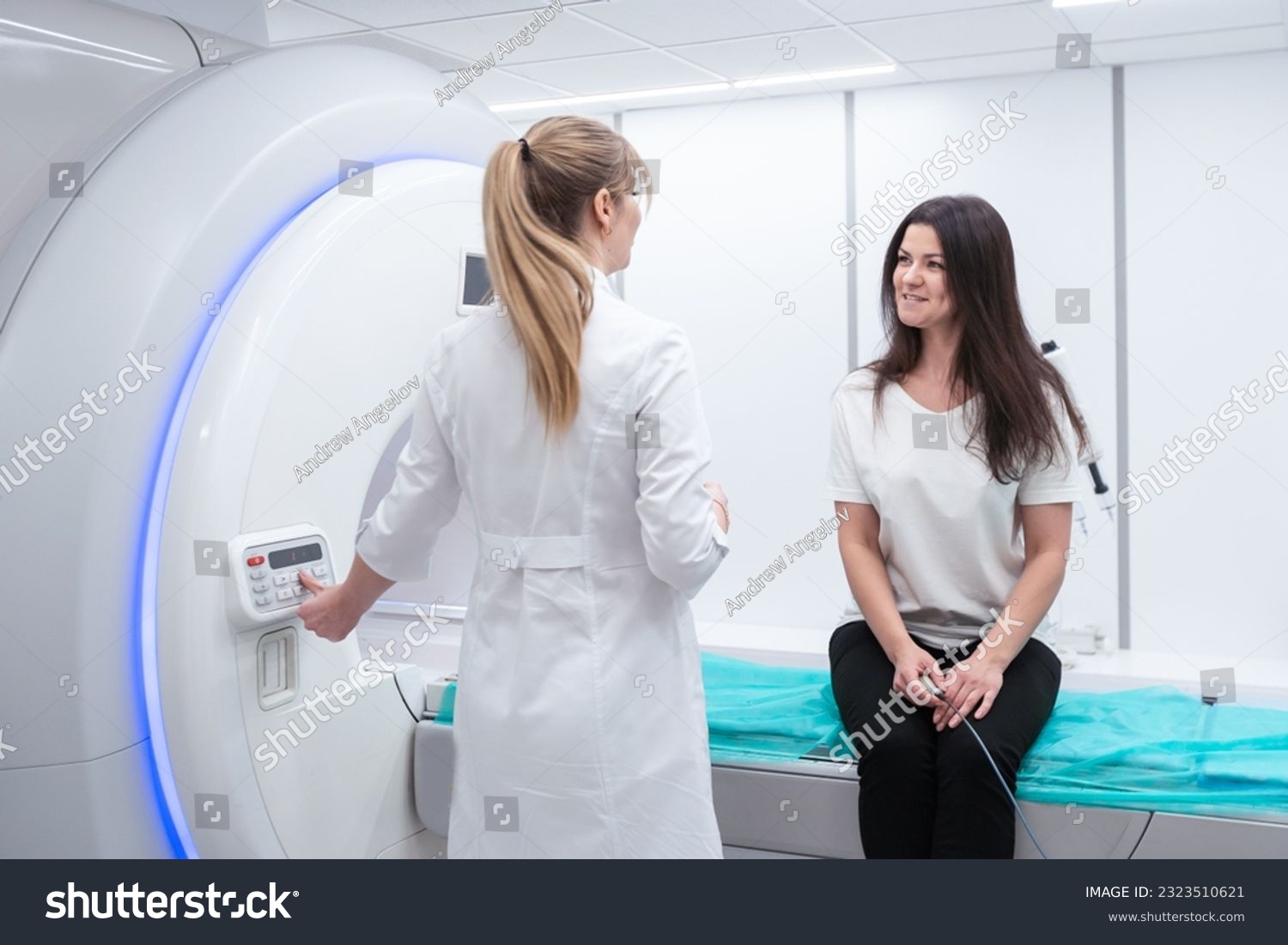 Female patient undergoing MRI - Magnetic resonance imaging in Hospital. Medical Equipment and Health Care #2323510621